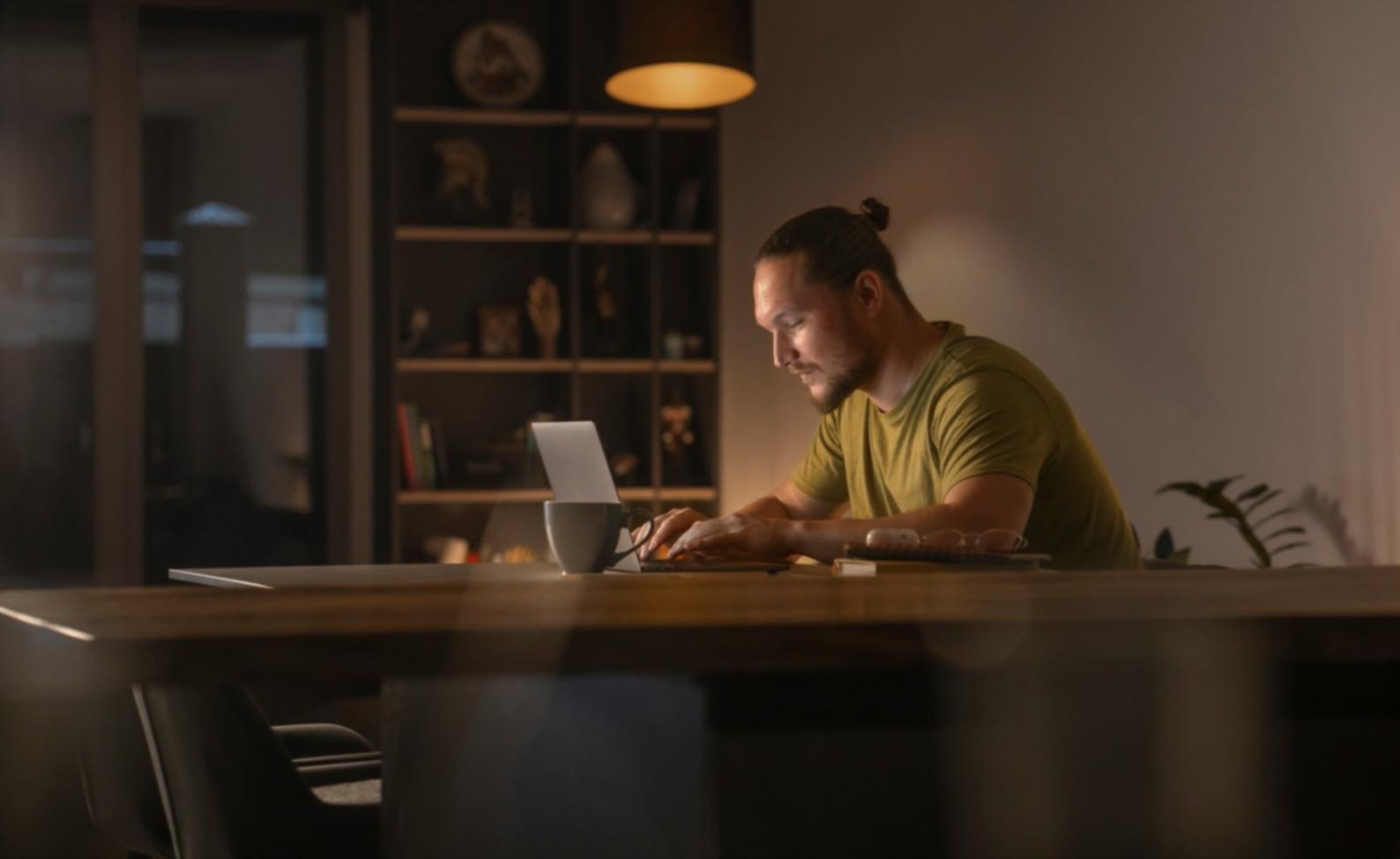 Modern classroom with digital displays showing economic charts and graphs