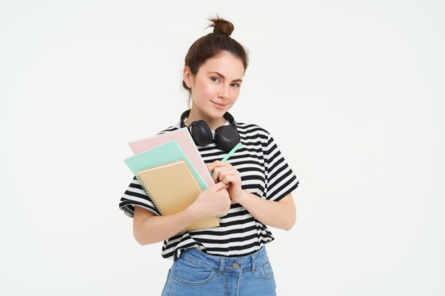 Students working on economic planning exercises in modern classroom setting